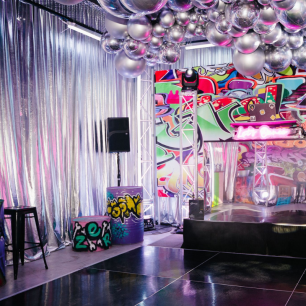 graffiti themed party with silver draped walls