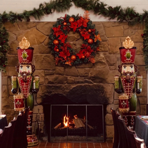 christmas nutcrackers beside fireplace