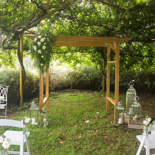wooden wedding arch under the tree