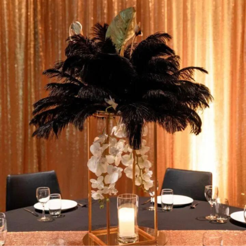 gold centrepiece with black feathers