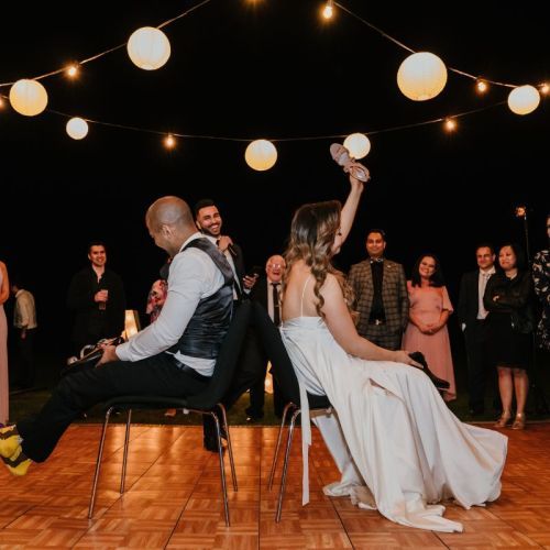 festoon lights hanging dancefloor wedding bride and groom