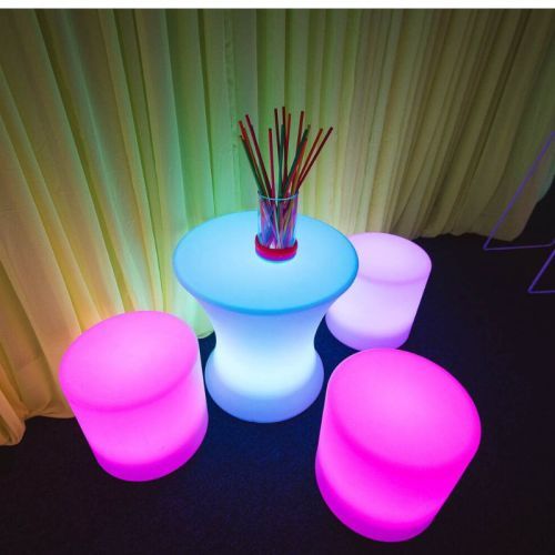 illuminated stools and small bar tables