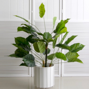 white wire pot stand with plant