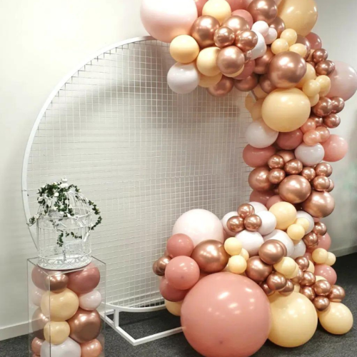 white round mesh backdrop with pink ballon garland