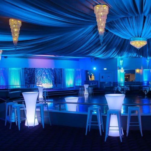 blue wash mood lighting white illuminated high bar table and stools san remo ballroom