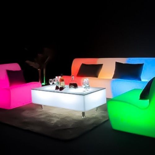 Glow illuminated furniture couches and low lying table 
