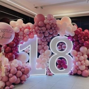 pink balloon display with large 18 lit up 