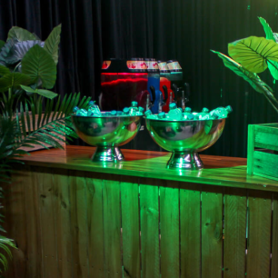 green lighting wooden bar with champagne bowls filled with water