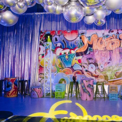 graffiti party with painted oil drum tables