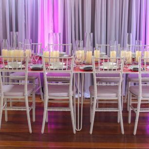 dining set up with white tiffany chairs