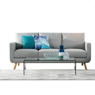 grey sofa staged with blue pillows