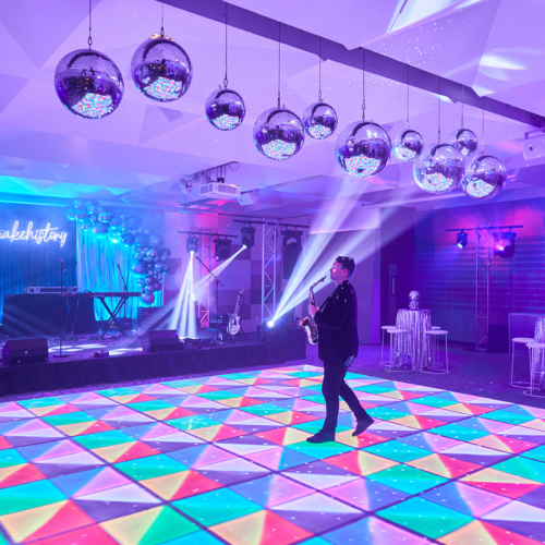 multicolored LED dancefloor with Saxophone player