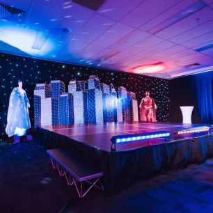 superhero themed party with stage red and blue lighting