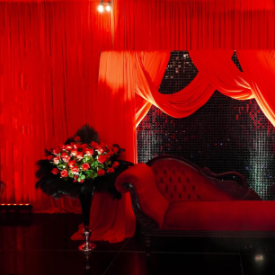 red luxury lounge, red roses and sofa