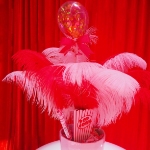 red and white feathers circus centrepiece
