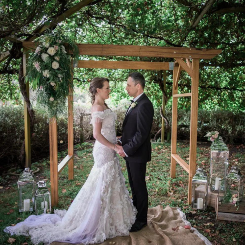 rustic themed wooden wedding arch 