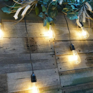 rustic wooden backdrop panel with festoon lights
