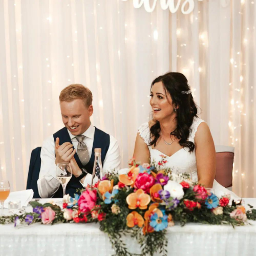married couple bridal table fairy light backdrop