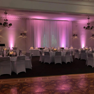 light pink wedding reception chiffon drape set up