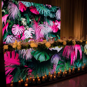 tropical pink and green graphic LED video screen bridal table