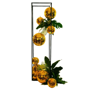 golden mirror balls with tropical plants