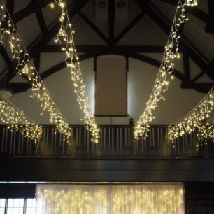 icicle lights hanging in barn wedding