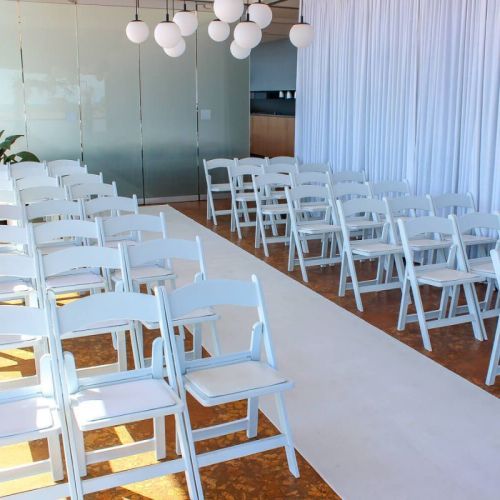 Wedding Ceremony indoor white chairs