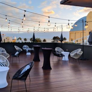 roof top party with high bar table with black covers
