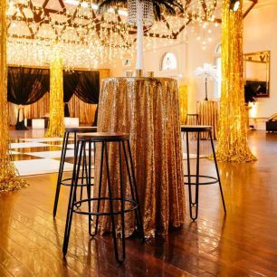 black and gold theme high bar tables gold sequin overlay