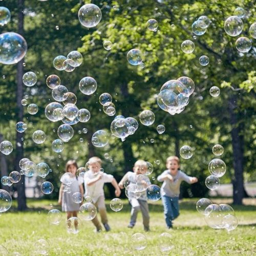 kids running towards bubbles 
